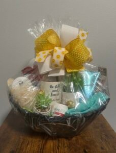 Spa and comfort gift basket with towell, and snacks